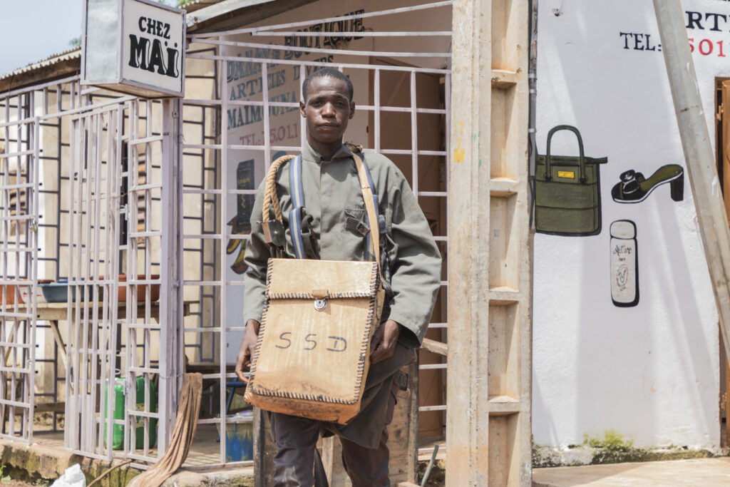 service mechanic with toolbag around neck