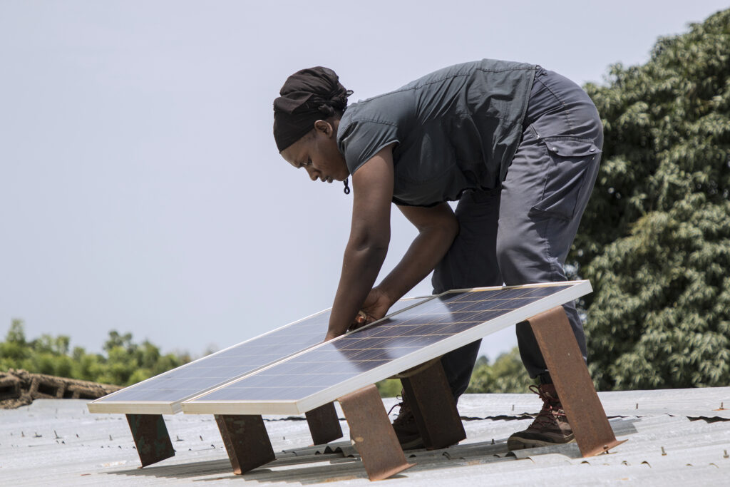Yeelen Kura technician Mariam Niaré doing maintenance work on a solar home system at a customer’s house in Nimbougou, Mali.